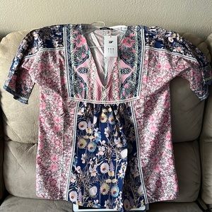 Brand NEW smocked top. Short sleeve blue an pink pattern.  Tag still on.